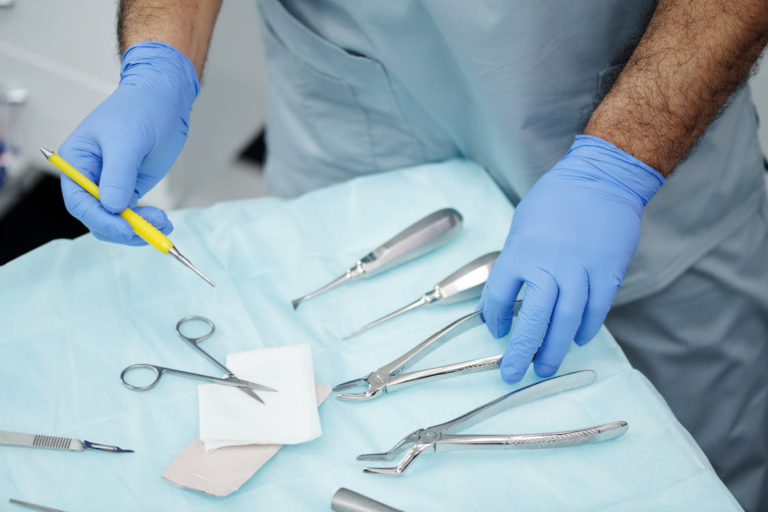 A healthcare professional holding medical tools